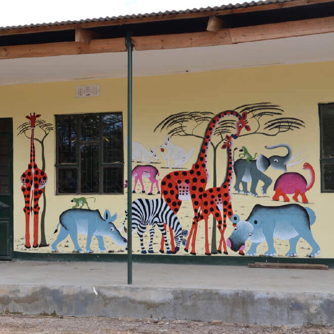 African animals painted mural on school wall