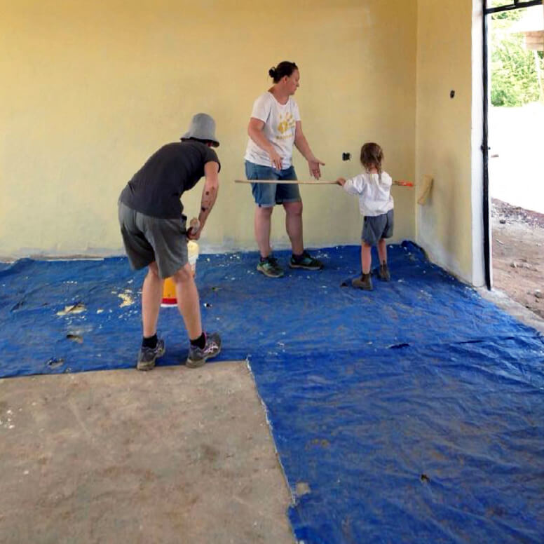 Volunteers painting walls at the Bandari Project