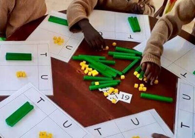 Bandari students working with maths resources at table